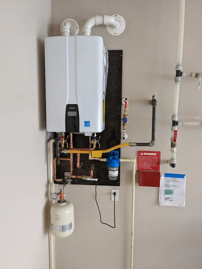 Professional plumber installing copper piping in a Mamaroneck home